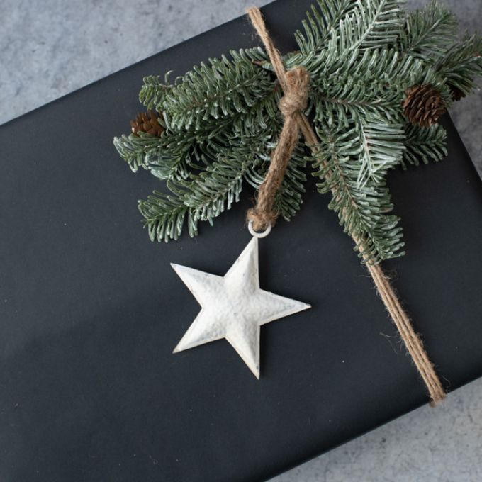 White Star Ornaments - Three Sizes are white hammered metal stars that hang from jute. Available at Quilted Cabin Home Decor.