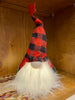 The Red and Black LED Gnome has a fuzzy whisy beard with a a red and black plaid hat with a red star on the top. The body of the gnome lights with an LED light. 