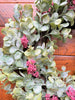 The wreath of the holiday eucalyptus collection. White dusted eucaluptus leaves with red berries incorporated throughout. 