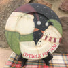 A wooden plate that is handpainted. It is a farmhouse style and has two snowmen on it and they say I'd melt for you. The owrds are in red on the rim, and the snowmen are dressed in green and red hats and scarves.