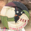 A wooden plate that is handpainted. It is a farmhouse style and has two snowmen on it and they say I'd melt for you. The owrds are in red on the rim, and the snowmen are dressed in green and red hats and scarves.