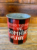The red and black buffalo plaid vintage christmas metal can that says Good Tidings of Great Joy 