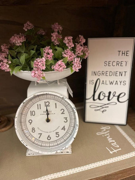 The Vintage White Scale with Clock is shown with other decor.