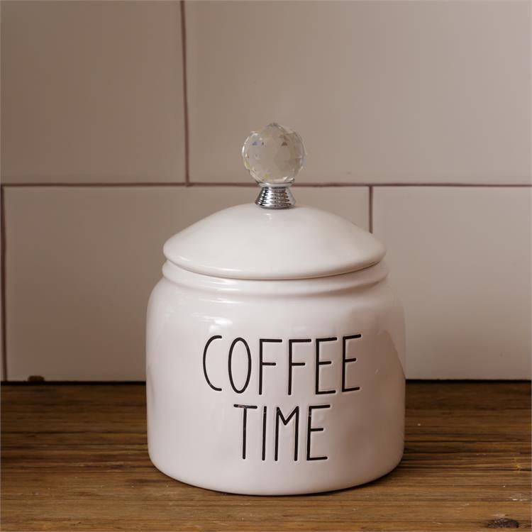 White, farmhouse style ceramic coffee container. It has a glass knob on the white ceramic lid. The words Coffee Time are on one side of the container. 