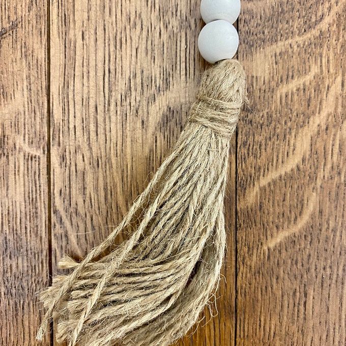 Washed Wooden Bead Garland with Tassel - 13" long available at Quilted Cabin Home Decor.