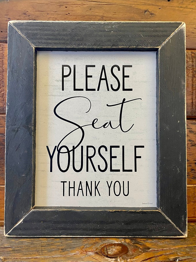 A black wooden framed signs that says Please Seat Yourself. thank you.