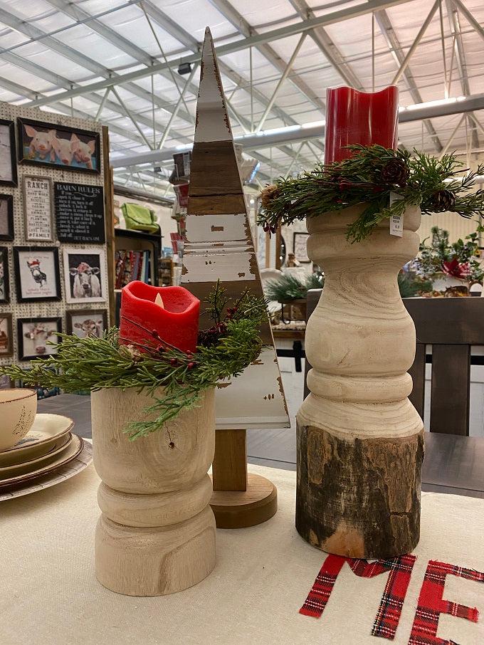 Rustic White wooden trees shown in both the large and small size. They are distressed white and a natural wood colour. The base is round. Shown here with other christmas decor.