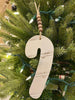 The Candy Cane Chippy wood ornament. The ornament is white and at the top is natural coloured brown beads strung on a jute hanger.