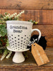 The Grandma Bear mug is white with black hearts in rows on the bottom half of the mug. It is printed on both sides. 