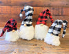 Black and white checked hats make these gnomes perfect for the holidays. They have a full bushy faux fur beard and there is wire in the hat that allows you to move the hat in a number of different angles. The black and white hat gnomes are shown here with red and black checked hat gnomes.