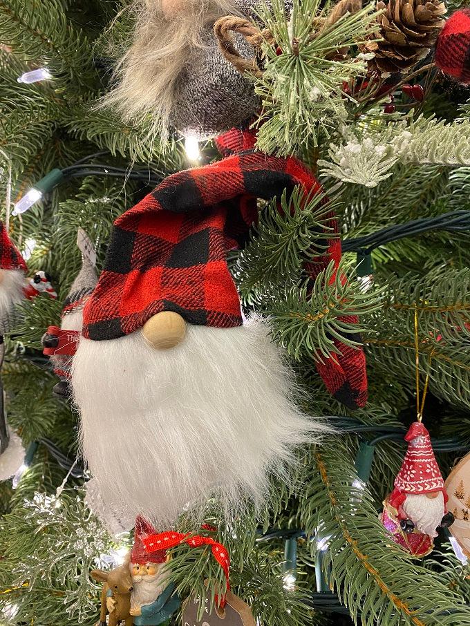 This is a red and black checked hat gnome. The gnome has a bushy faux fur beard and wire in the hat allows you to move the hat in a number of directions. This one is shown in a Christmas tree.