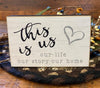 The Family Mini block sign that says: This is us - our life our story our home. The edges are black and the writing is gray and black. 