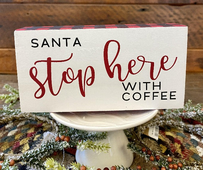 Santa Stop Here Christmas Block sign has a white background, red and black checked edge and says Santa Stop here with Coffee.