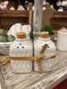 Glazed Salt and pepper shakers available at quilted cabin Home decor. Cork top and tied with a leather strap for easy gifting.