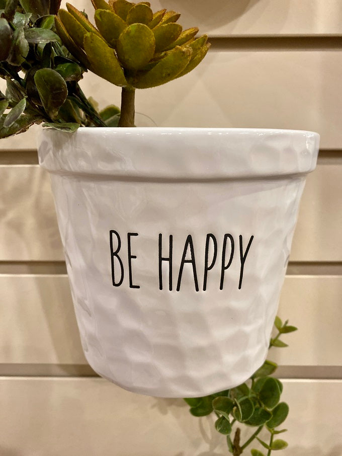 White Ceramic Hanging Pots - Three Styles available at Quilted Cabin Home Decor. The Be Happy Pot is shown.