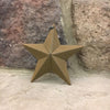 A close up photo of a mustard coloured farmhouse barn star. It is made of metal and can be hung using the green and ivory gingham fabric hanger. It is 5" wide.