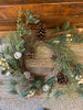  The Country snowberry floral wreath is filled with white berries, pinecones and pine and other greens. A few pretty silver jingle bells complete this full wreath.