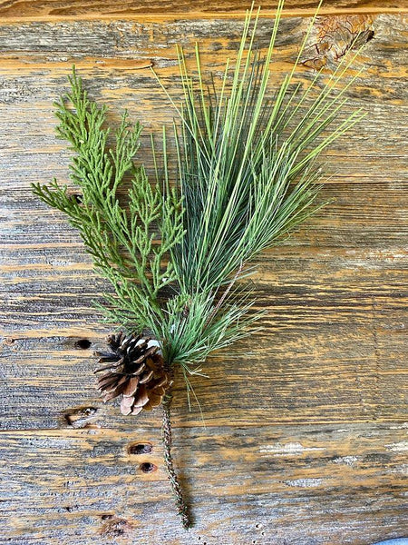 The Cedar Needle and Pine Cone Spray is the perfect green floral for holiday decorating. A large piece of cedar and pine together with one pine cone on a bendable wire.