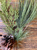 The Cedar Needle and Pine Cone Spray is the perfect green floral for holiday decorating. A large piece of cedar and pine together with one pine cone on a bendable wire.