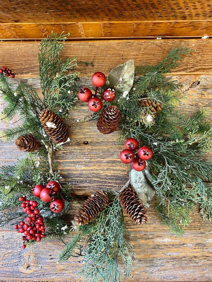  The Cedar and Red Berry Ring is filled with red berries, rose hips, pine cones, cedar and other greens. 