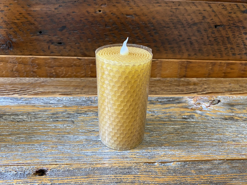 A 4" votive honeycomb candle is pictured. It has a white silicone wick.