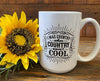 A white ceramic coffee mug that is imprinted on both sides with a sentiment that says I was Country when country wasn't cool. The words are printed in black and around them are stylized lines.   