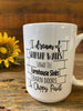 A white ceramic coffee mug that is imprinted on both sides with a sentiment that says I dream of Shiplap walls, Subway tile, farmhouse sinks, barn doors and chippy paint. The words are printed in black and set in a backdrop of shiplap board planks.