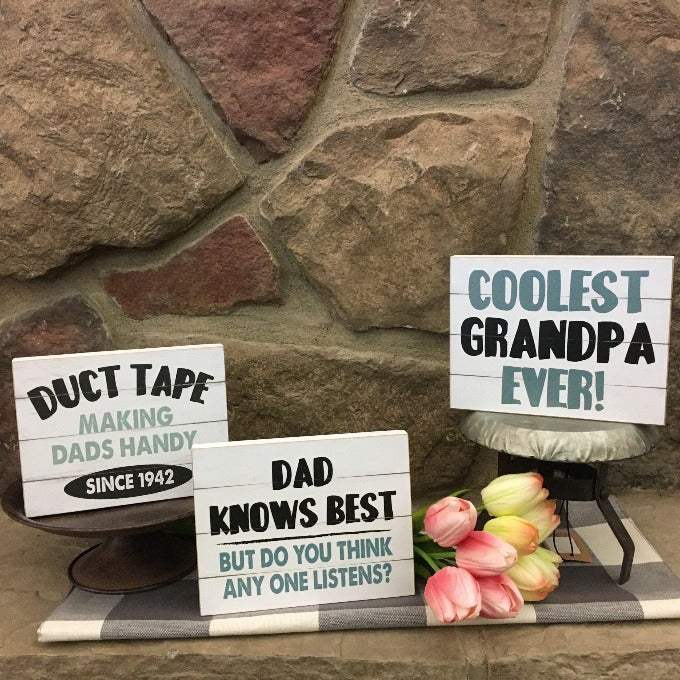Three fun farmhouse style signs. One says Duct Tape - making dads handy since 1924, One says Dad Knows Best - but do you think anyone listens? and the third says Coolest Grandpa Ever.