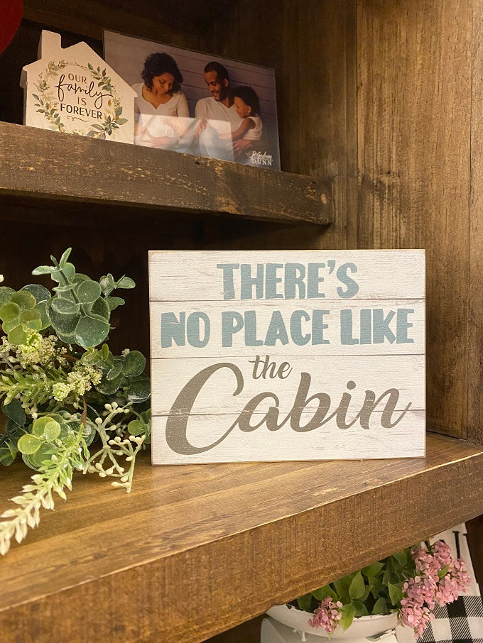 There's no place like the cabin wood sign can be hung or sit on a shelf.