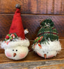 Two stuffed snowman ornaments with a tall red toque with a tiny jingle bell and one with a plaid green toque. Each one is accented with candy canes and greenery. 
