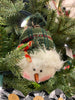 This little plush snowman has a green toque tied at the top. He has a round face, tiny carrot nose and painted face. 
