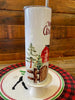 The Merry Christmas Red Barn Christmas Hot/Cold Tumbler bottle is wrapped in a pretty christmas  scene with a classic red barn and snow-filled evergreen trees. 