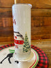 The Merry Christmas Red Barn Christmas Hot/Cold Tumbler bottle is wrapped in a pretty christmas  scene with a classic red barn and snow-filled evergreen trees. 