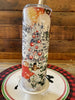 The Christmas Farm FreshHot/Cold Tumbler bottle is wrapped in a pretty christmas  scene with a vintage red truck and snow-filled evergreen trees. 