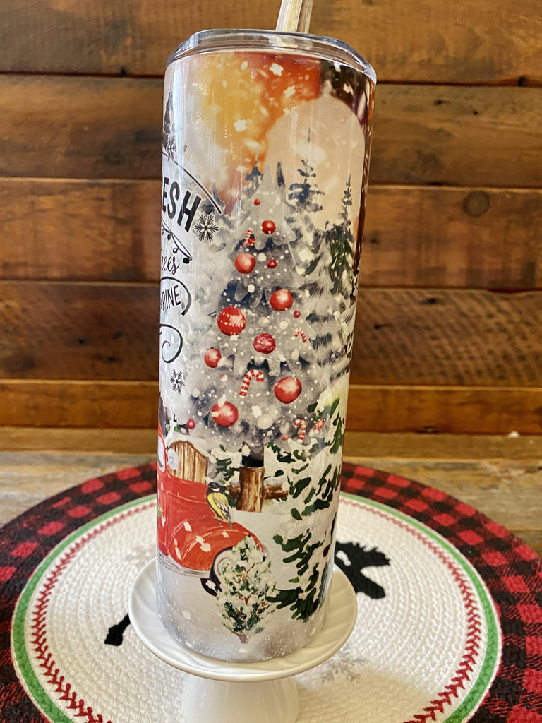 The Christmas Farm FreshHot/Cold Tumbler bottle is wrapped in a pretty christmas  scene with a vintage red truck and snow-filled evergreen trees. 