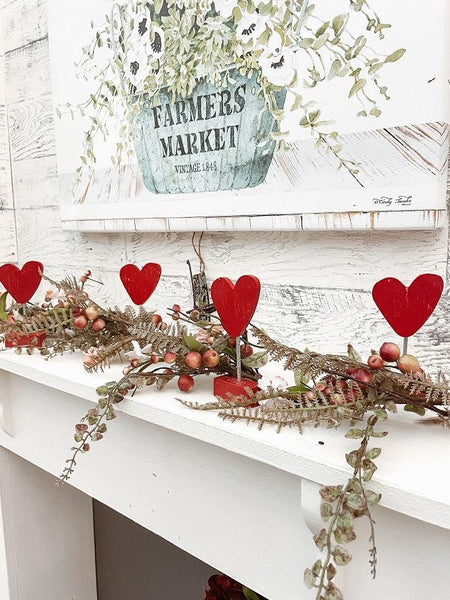 The Red Heart on Base is perfect for valentines. Four are shown here on a mantel.