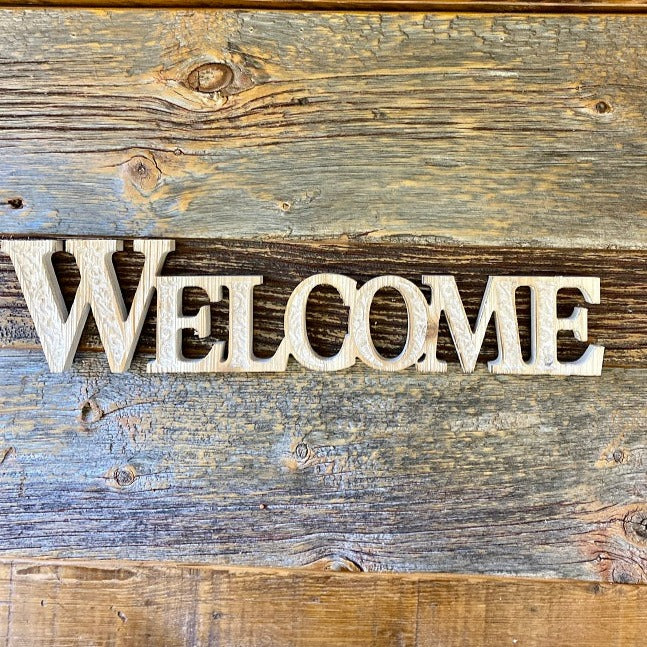 Welcome Word Cutout Sign available at quilted cabin home decor.