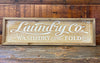 Distressed wood Farmhouse laundry sign available at quilted cabin home decor.