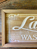 Distressed wood Farmhouse laundry sign available at quilted cabin home decor.