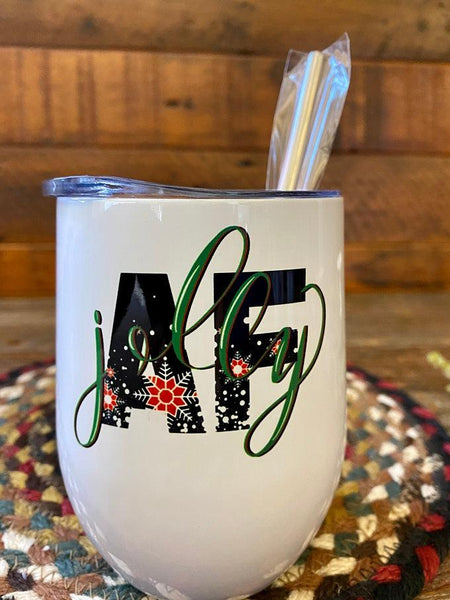 A white stainless steel wine tumbler with metal straw. The tumbler says JOLLY AF.   