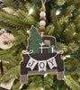 A farmhouse vintage black truck is packed with presents and beside a solid green evergreen tree on this wooden ornament with a beaded hanger. The JOY banner is hanging across the back of the truck.