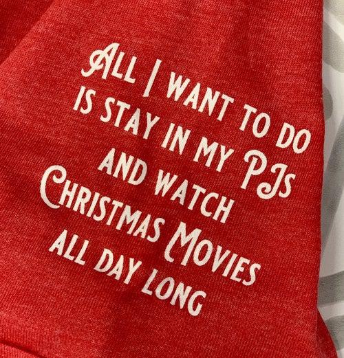 This Christmas Truck Shirt left sleeve reads " All I want to do is stay in my PJs and watch Christmas Movies all day long."