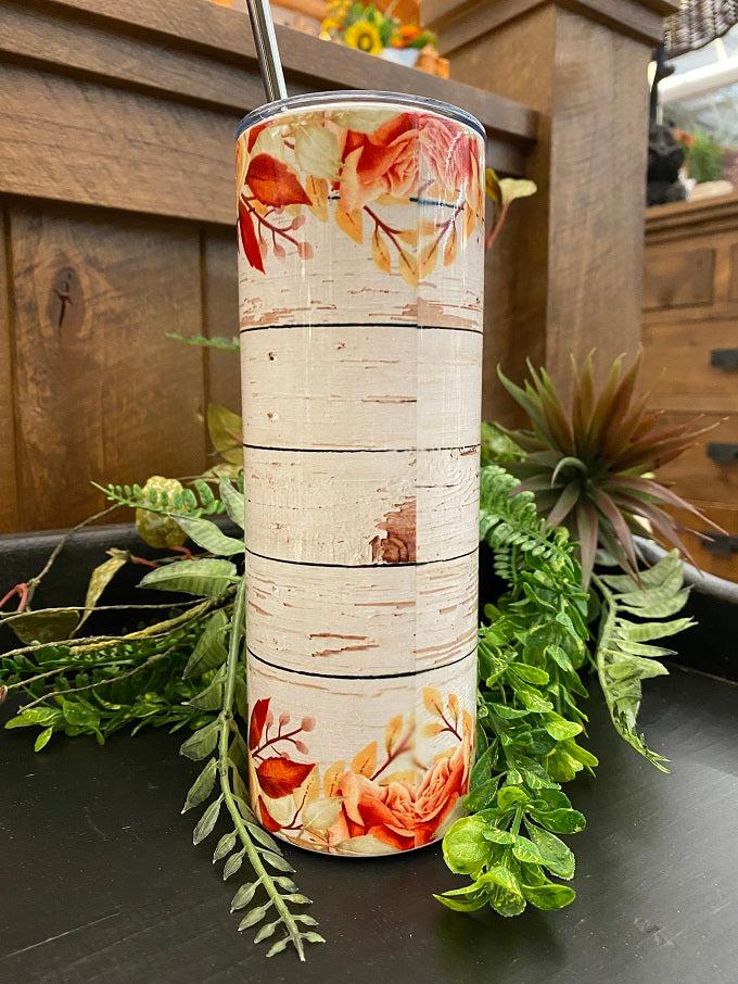 This is an enamel coated stainless steel water bottle, so it looks shiney! The photo shows the back side of the water bottle  that is imprinted all the way around with a barnwood design and pink roses on the top and bottom of the bottle